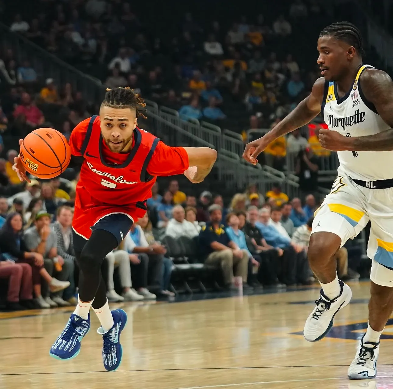 CJ Luster II driving in college basketball game action