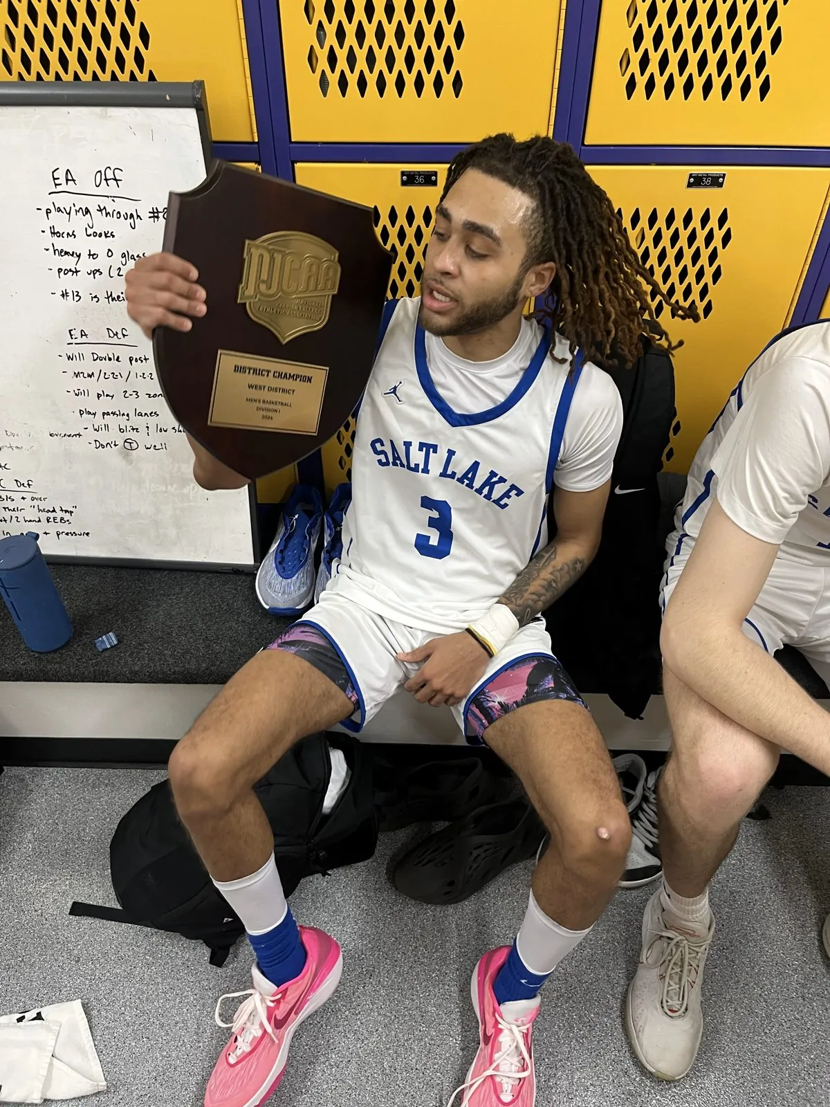 CJ Luster II holding the Salt Lake CC championship plaque